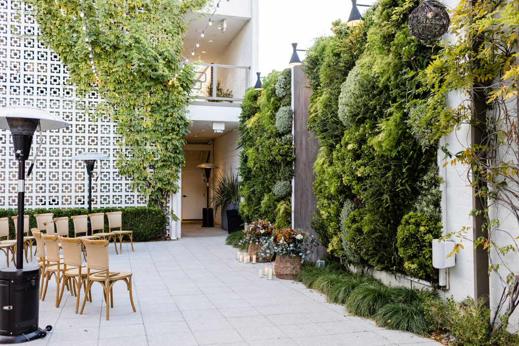Modern wedding ceremony space featuring a living green wall in Newhall California