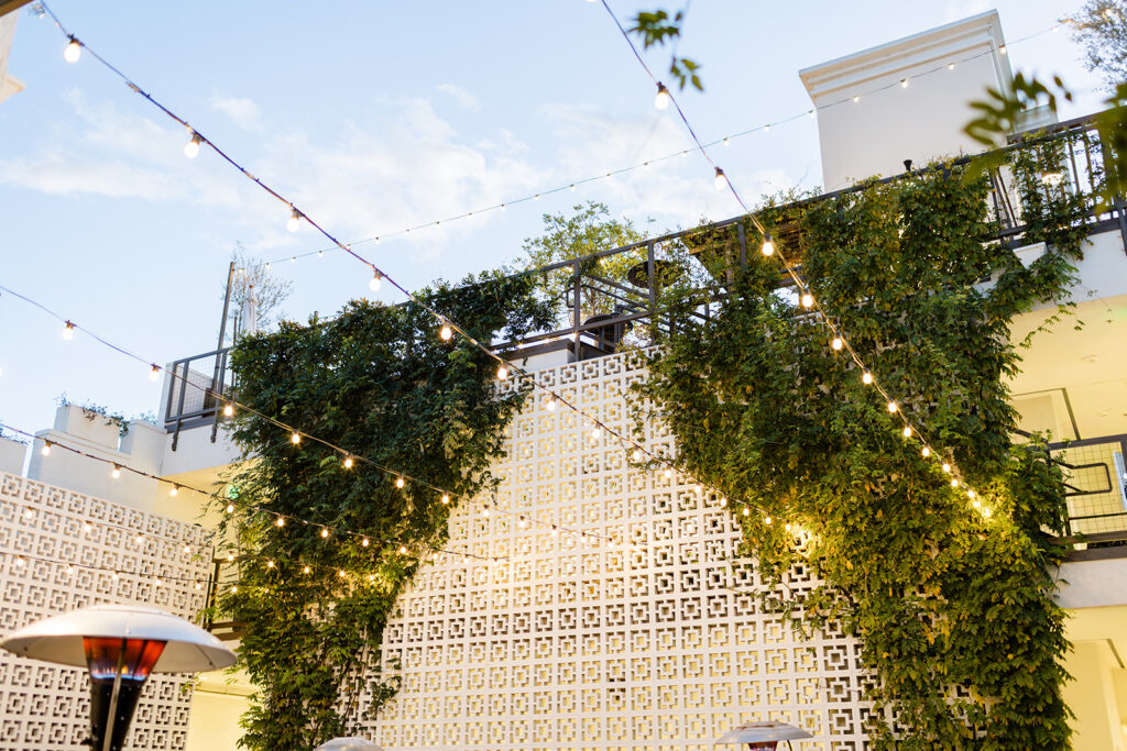 Industrial modern wedding venue with living greenery wall in Santa Clarita CA