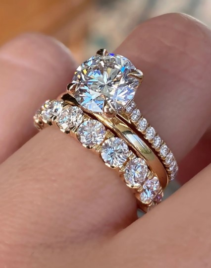 Modern wedding ring stack featuring gold and diamond bands